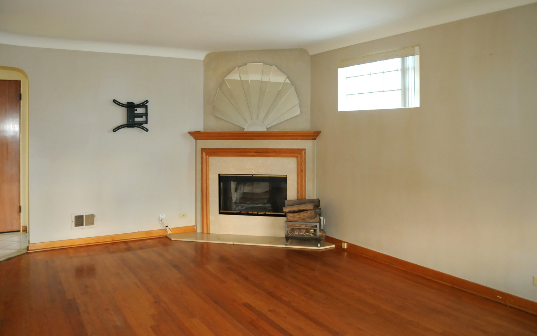 2436 2nd Avenue North Riverside, IL 60546 - Photo 3 of 26 an empty room with a fireplace and wooden floor