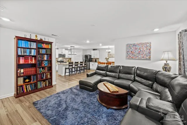 a view of a livingroom with furniture and wooden floor
