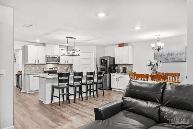 a bedroom with a bed and a mirror