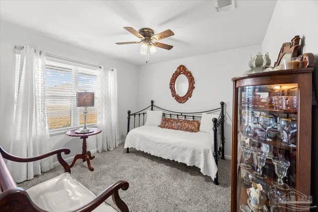 a bathroom with a sink mirror vanity and toilet