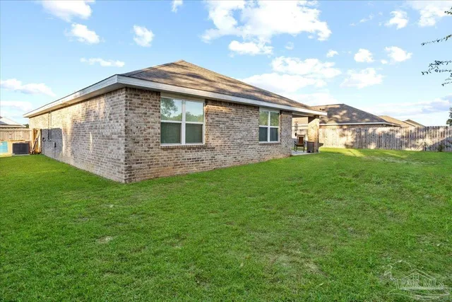 a view of swimming pool with a yard