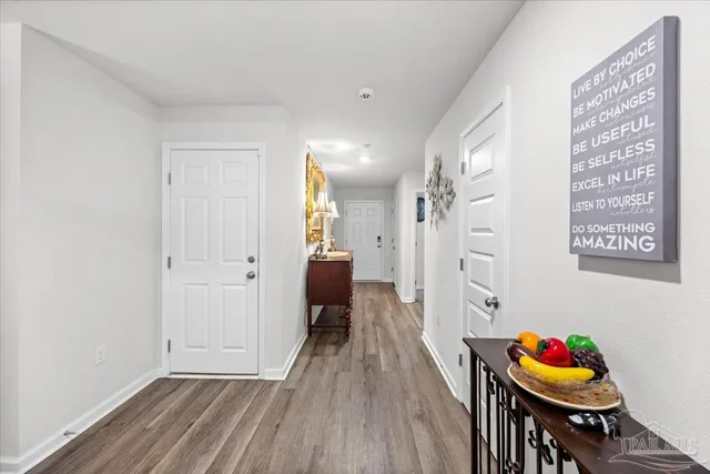 a hallway with wooden floor