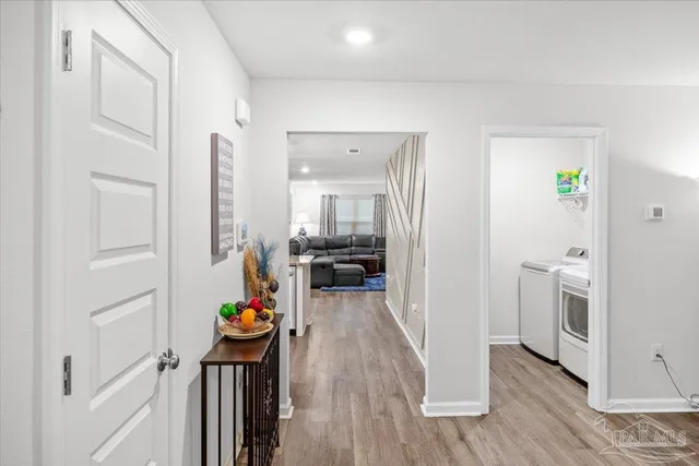 a kitchen with refrigerator a stove and chairs