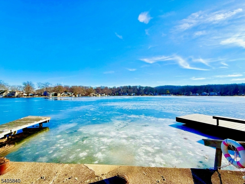a view of a lake with houses in the back