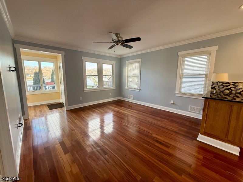 40 West Shore Road Denville, NJ 07834 - Photo 8 of 31 an empty room with wooden floor and windows
