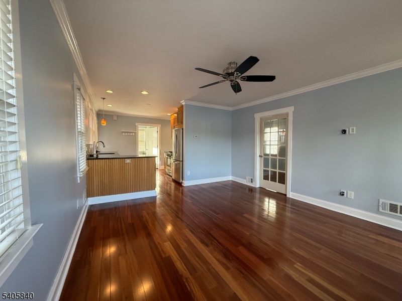 40 West Shore Road Denville, NJ 07834 - Photo 9 of 31 a view of an empty room with wooden floor and a window