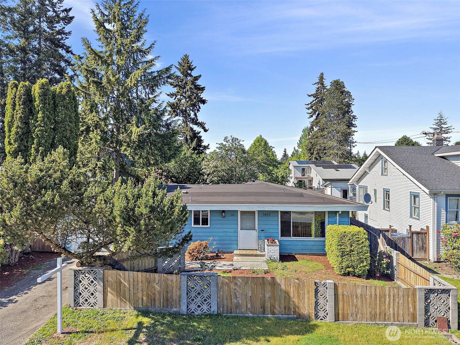 1410 Southwest 149th Street Burien, WA 98166 - Photo 2 of 37 a front view of house with yard outdoor seating and green space