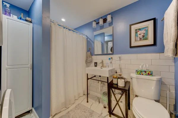 a view of a hallway with washer and dryer