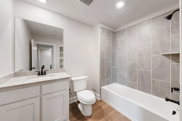a bathroom with a sink a toilet and a bathtub