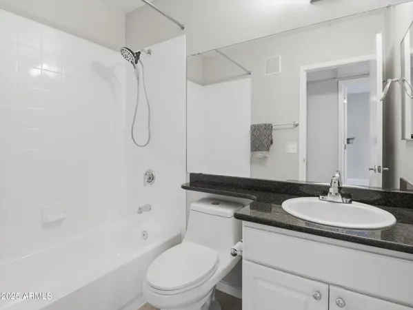 a bathroom with a sink toilet a shower and a mirror