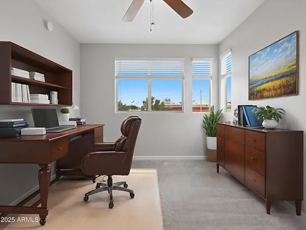a workspace with furniture and window