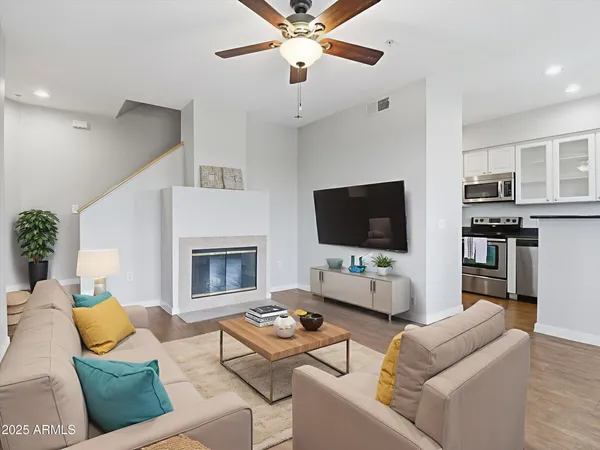 a living room with furniture and a flat screen tv
