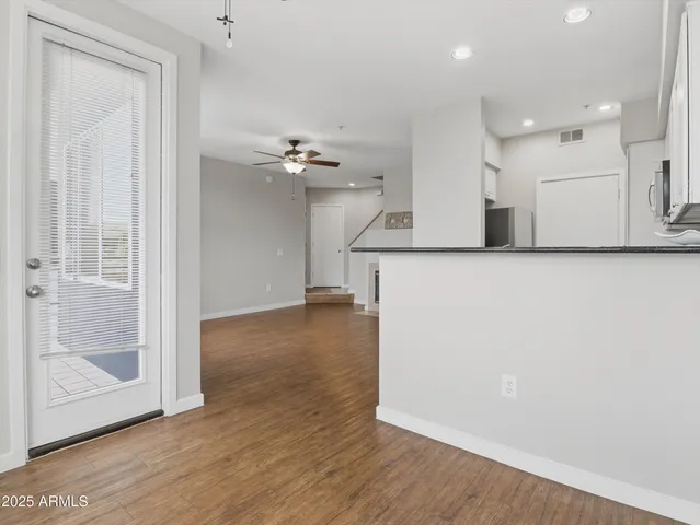 a view of a kitchen with wooden floor