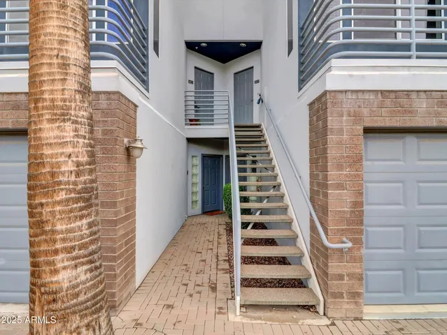 a view of a staircase with white walls