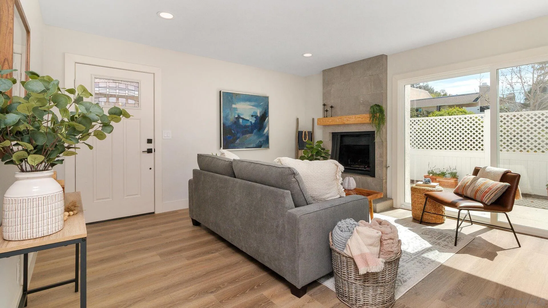 1371 Evergreen Drive Cardiff, CA 92007 - Photo 5 of 25 a living room with furniture a fireplace and a potted plant