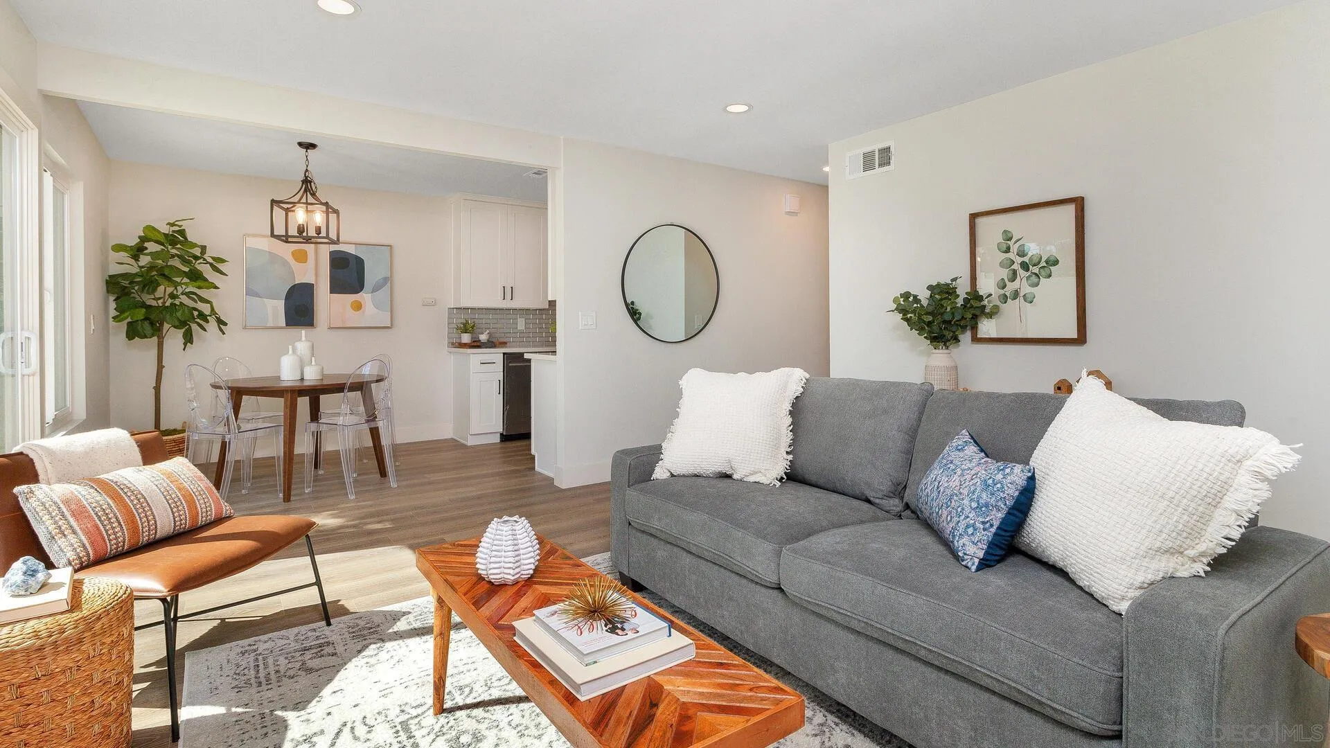 1371 Evergreen Drive Cardiff, CA 92007 - Photo 8 of 25 a living room with furniture a table and a chandelier