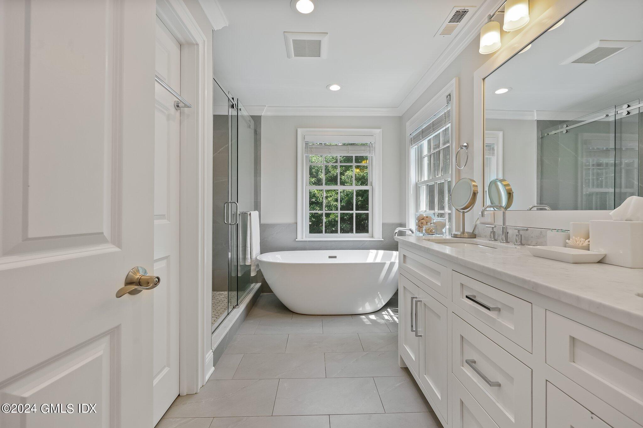 4 Grimes Road Old Greenwich, CT 06870 - Photo 12 of 22 a bathroom with a granite countertop sink tub and shower