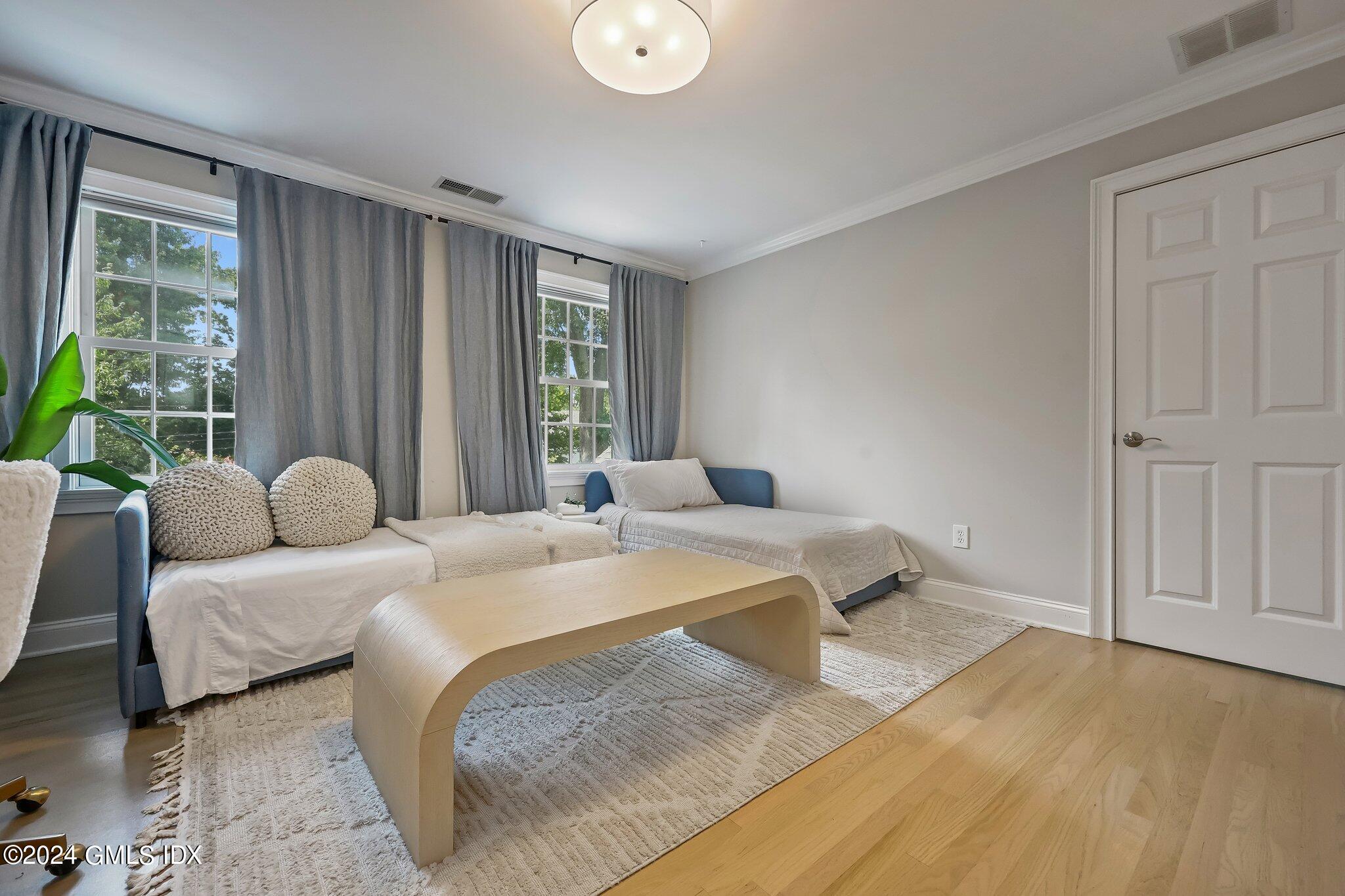 4 Grimes Road Old Greenwich, CT 06870 - Photo 13 of 22 a bedroom with a bed and window