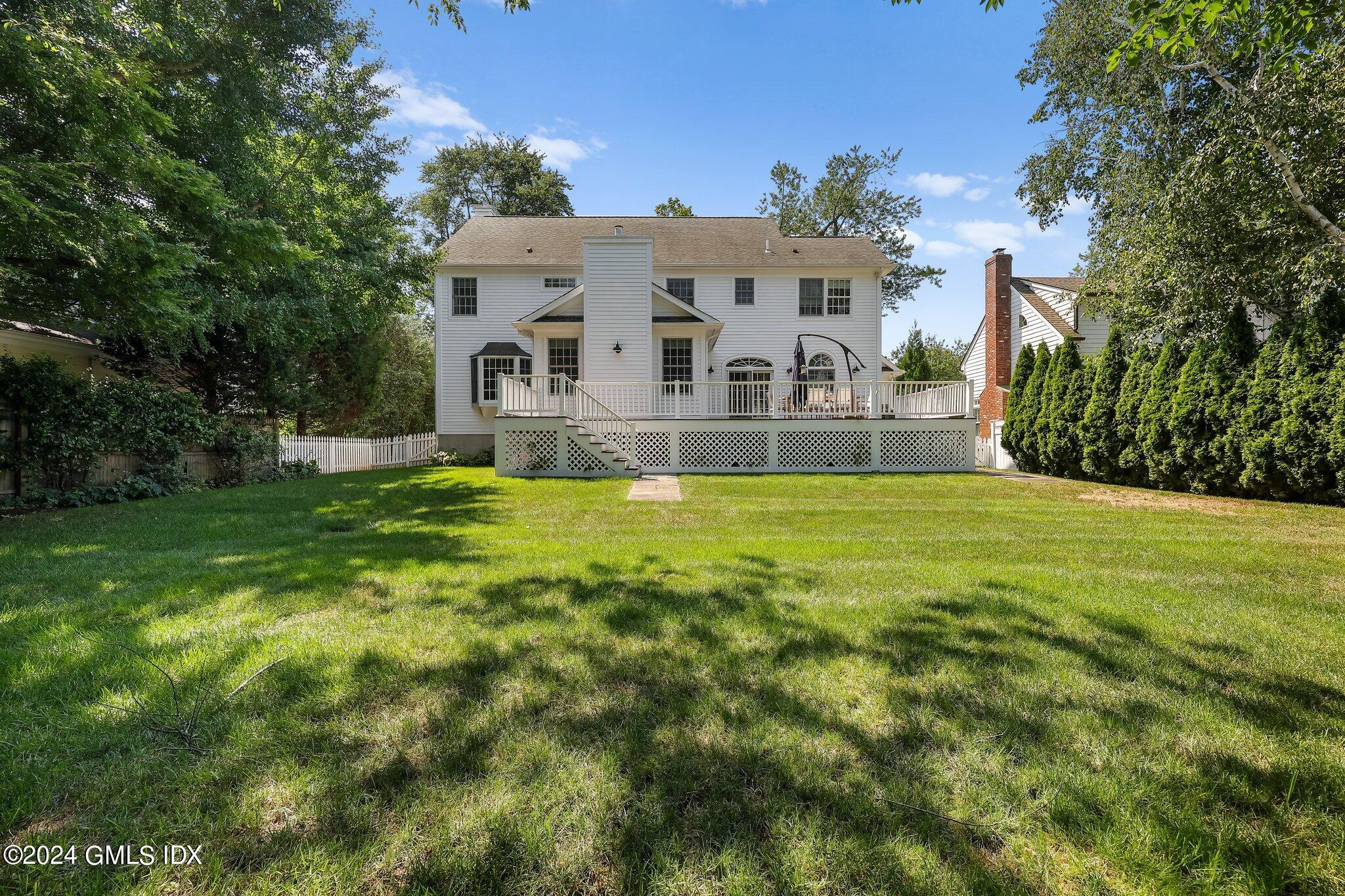 4 Grimes Road Old Greenwich, CT 06870 - Photo 20 of 22 a view of house with garden