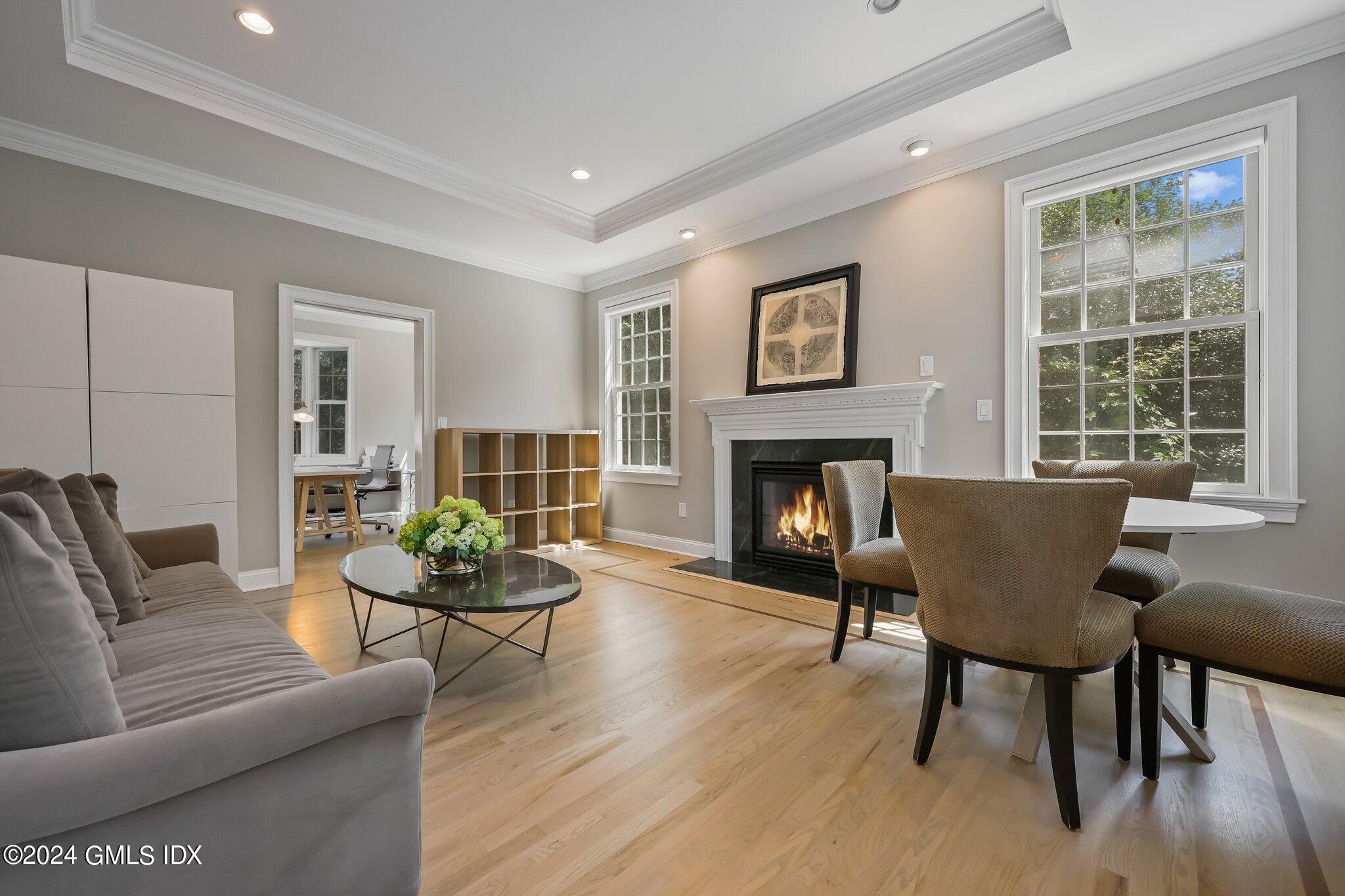 4 Grimes Road Old Greenwich, CT 06870 - Photo 4 of 22 a living room with furniture and a fireplace