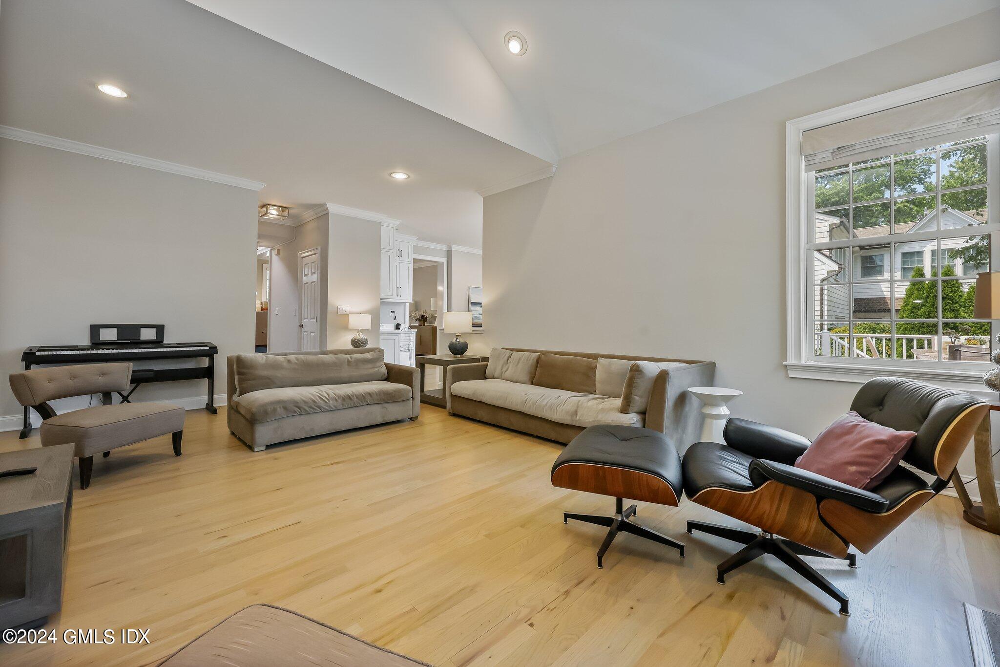 4 Grimes Road Old Greenwich, CT 06870 - Photo 7 of 22 a living room with furniture and a large window