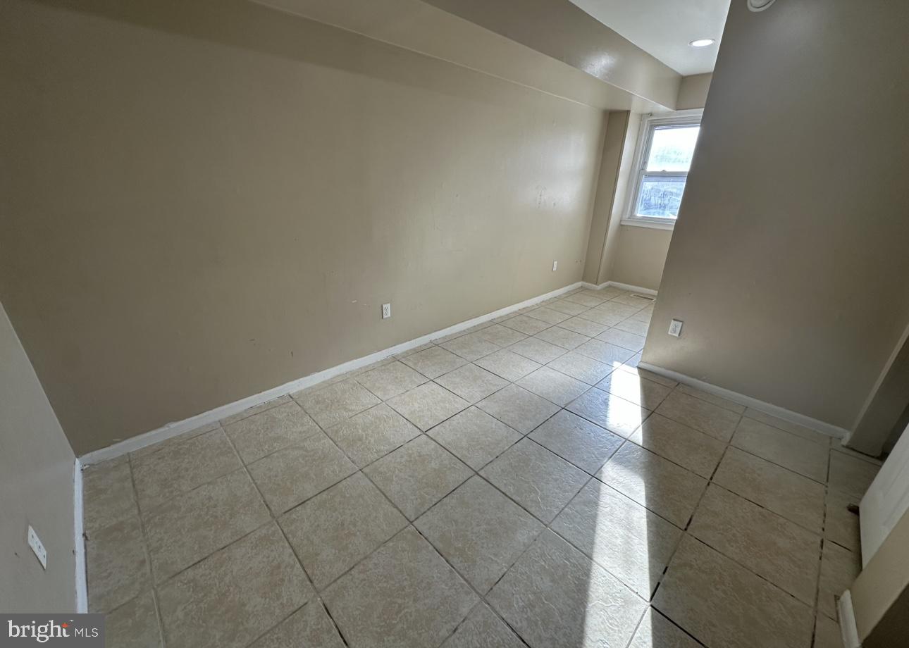 4430 Solly Avenue, Unit 2 Philadelphia, PA 19136 - Photo 9 of 13 en empty room with windows