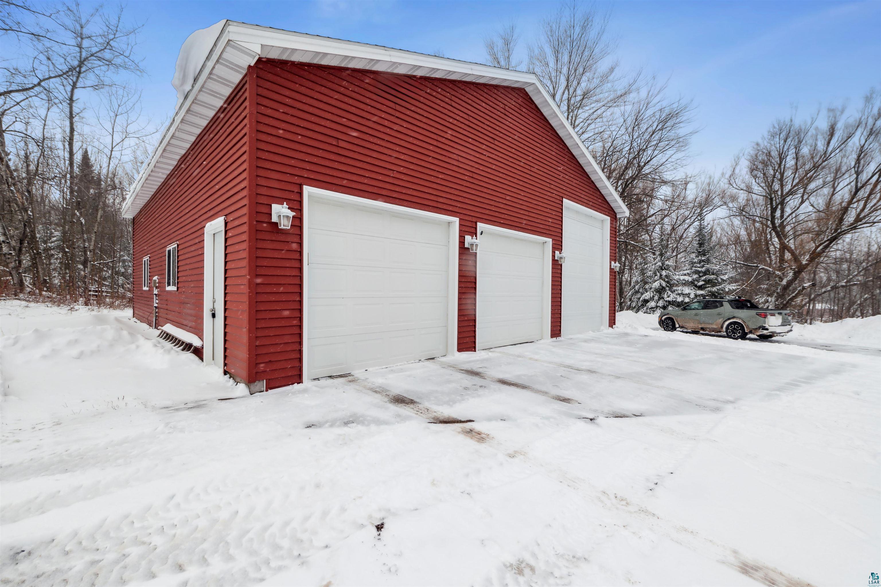 7212 County Road East South Range, WI 54874 - Photo 21 of 34 Snow covered garage with a garage