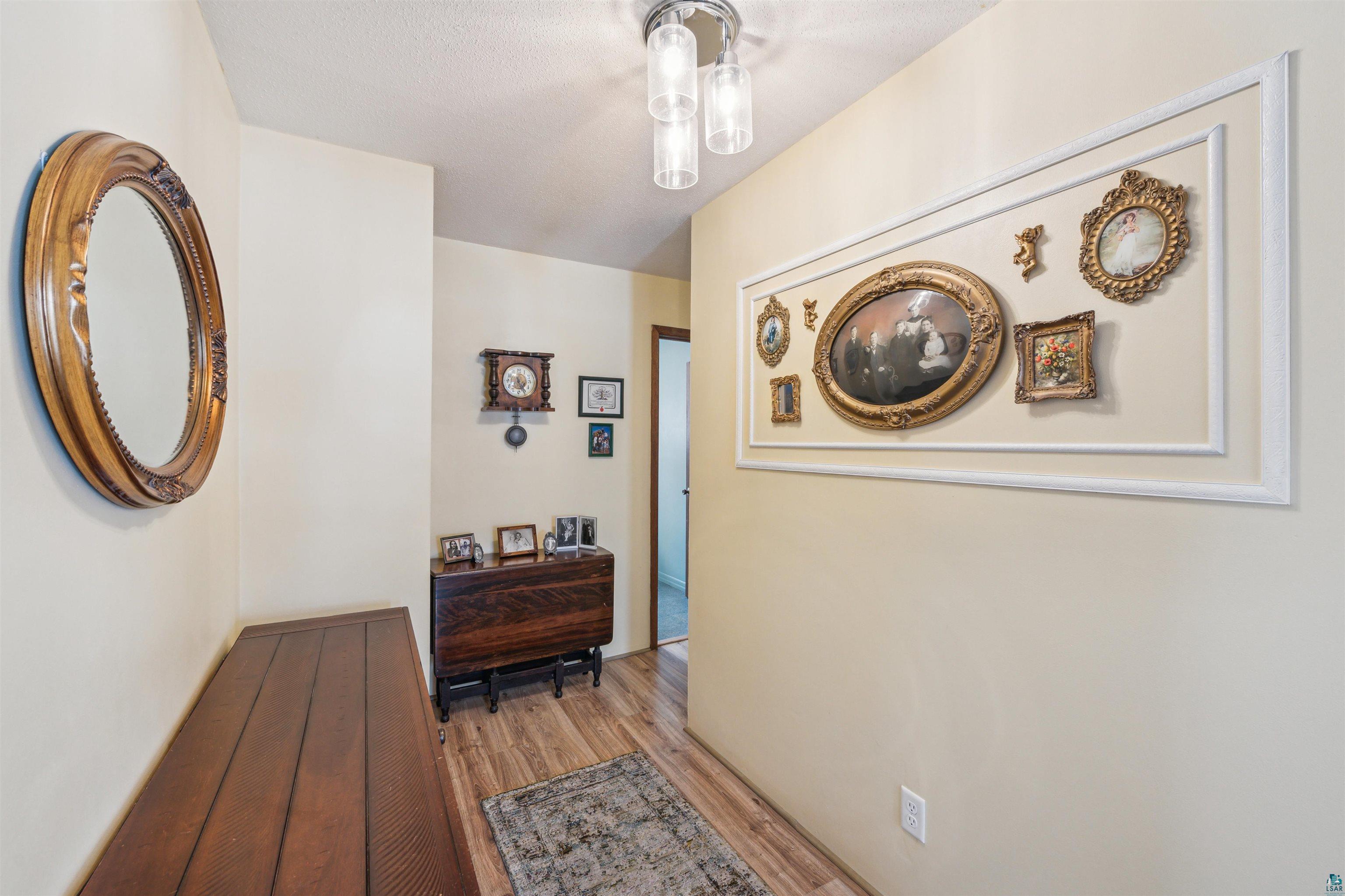7212 County Road East South Range, WI 54874 - Photo 7 of 34 Lovely entryway with a French door and soothing colors.