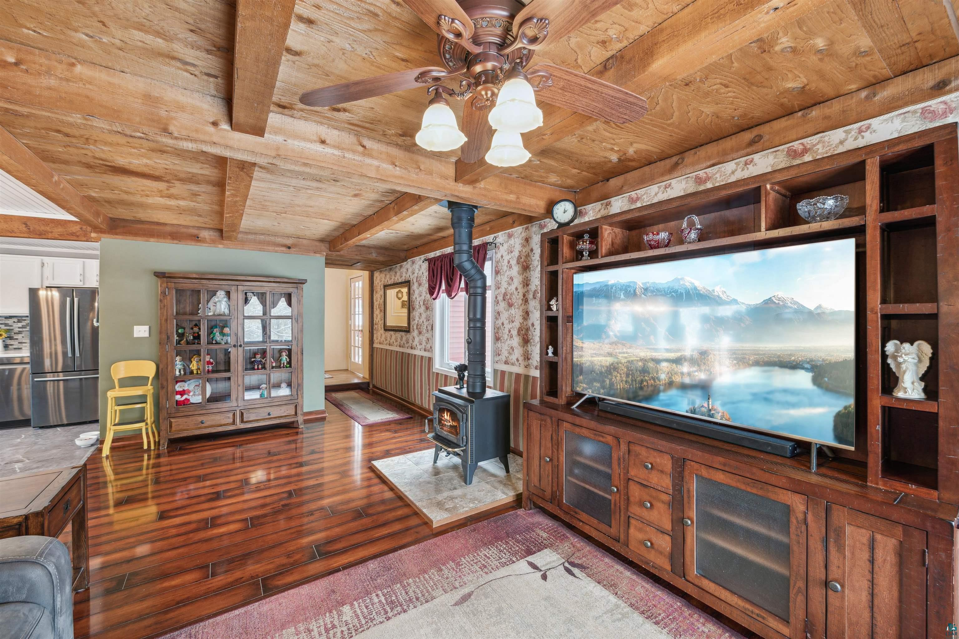 7212 County Road East South Range, WI 54874 - Photo 8 of 34 Beamed ceilings, gorgeous floor, combined with kitchen/dining.