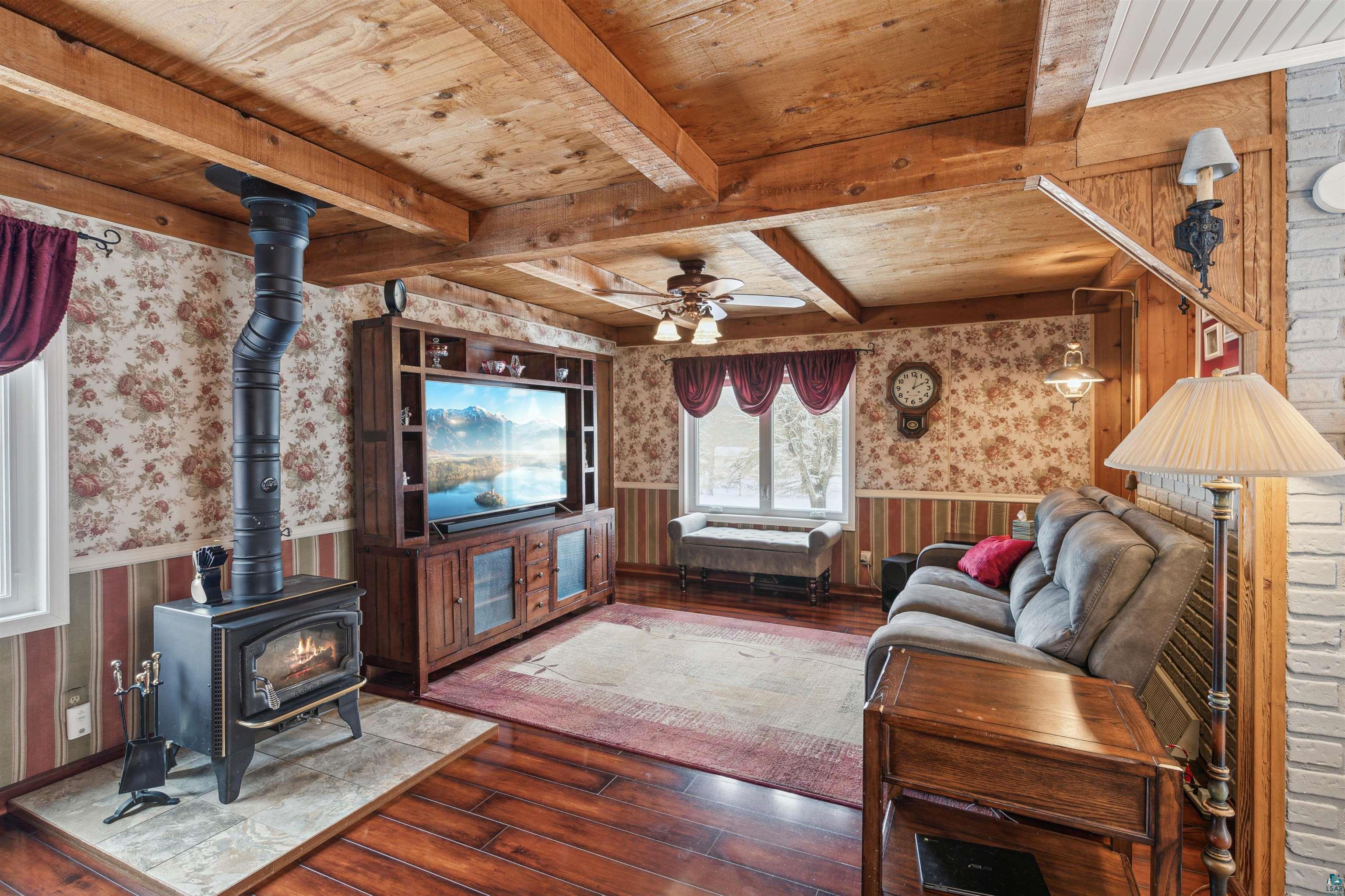 7212 County Road East South Range, WI 54874 - Photo 9 of 34 Wood stove is able to heat entire home and create a cozy atmosphere.
