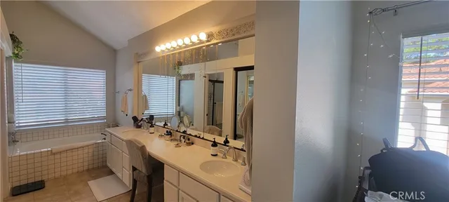 a bedroom with a balcony a bed and a couch