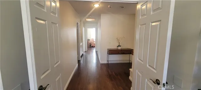 a bathroom with a granite countertop shower sink vanity mirror and toilet