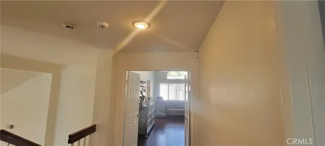 a view of an house with backyard and trees