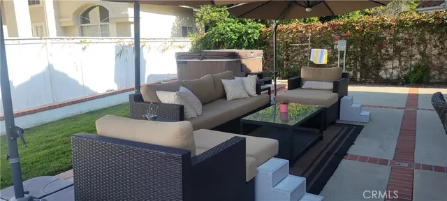 a backyard of a house with outdoor seating