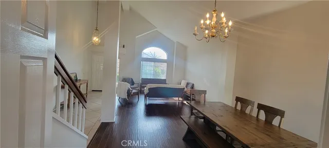 a view of a livingroom with furniture window and wooden floor