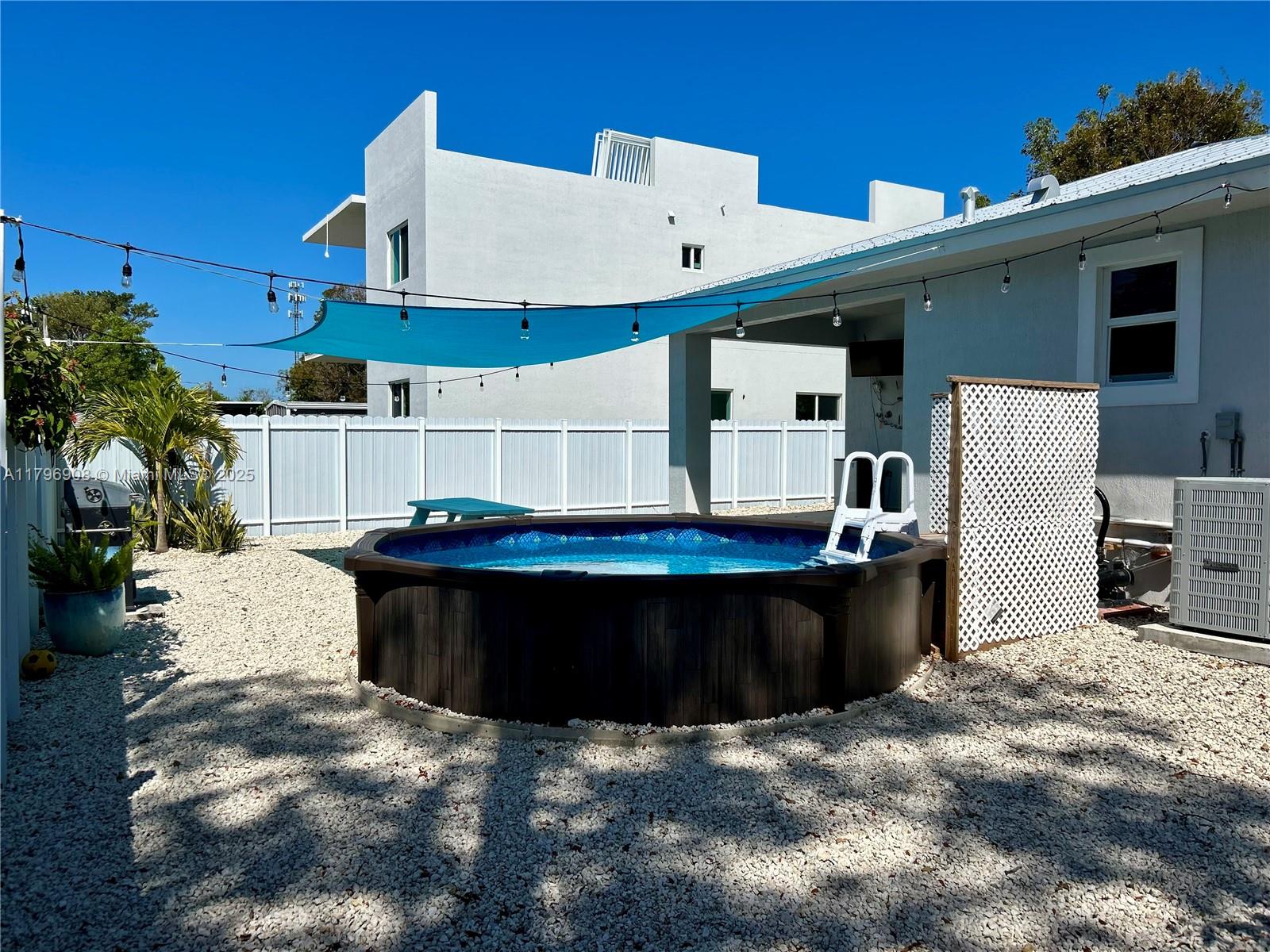 730 Largo Road Key Largo, FL 33037 - Photo 11 of 29 a view of a back yard with patio