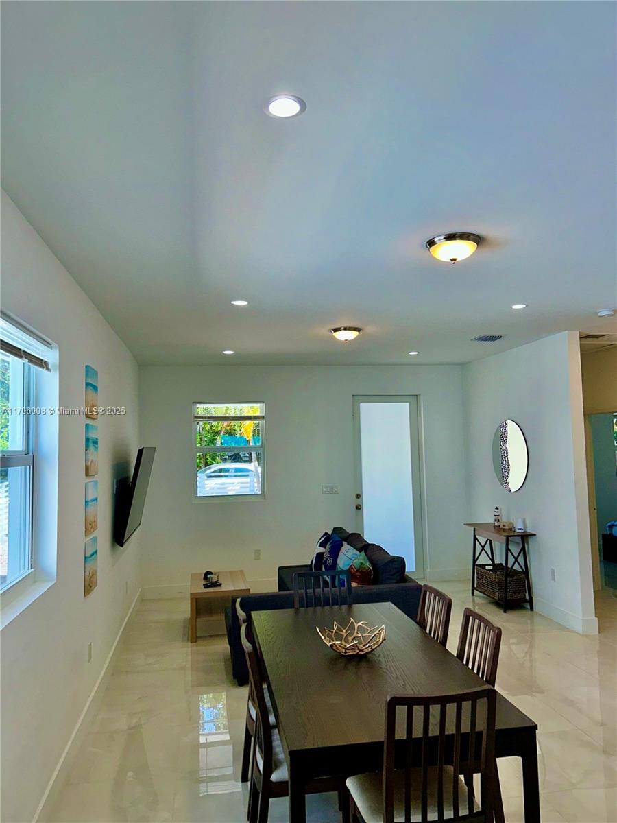 730 Largo Road Key Largo, FL 33037 - Photo 14 of 29 a view of a a dining room with furniture and window