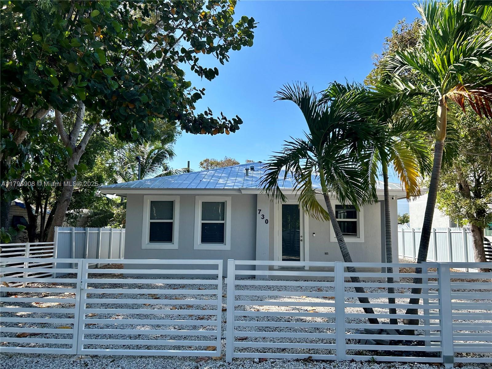 730 Largo Road Key Largo, FL 33037 - Photo 2 of 29 a view of a house with a tree