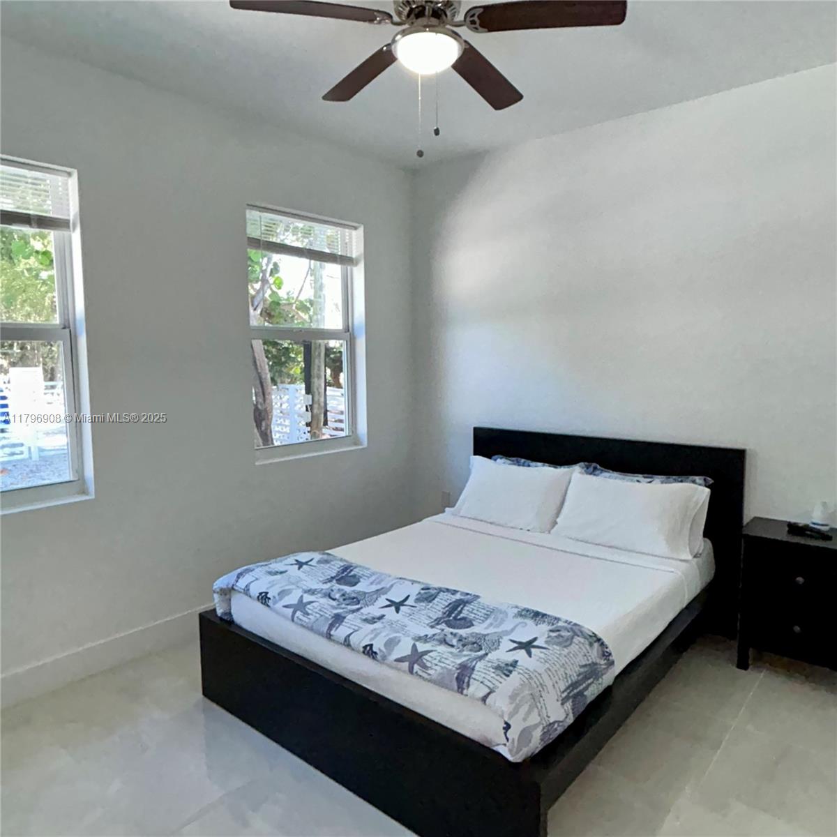 730 Largo Road Key Largo, FL 33037 - Photo 24 of 29 a bedroom with a bed and a window
