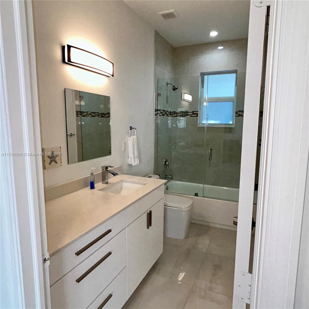 730 Largo Road Key Largo, FL 33037 - Photo 27 of 29 a bathroom with a sink a toilet and shower