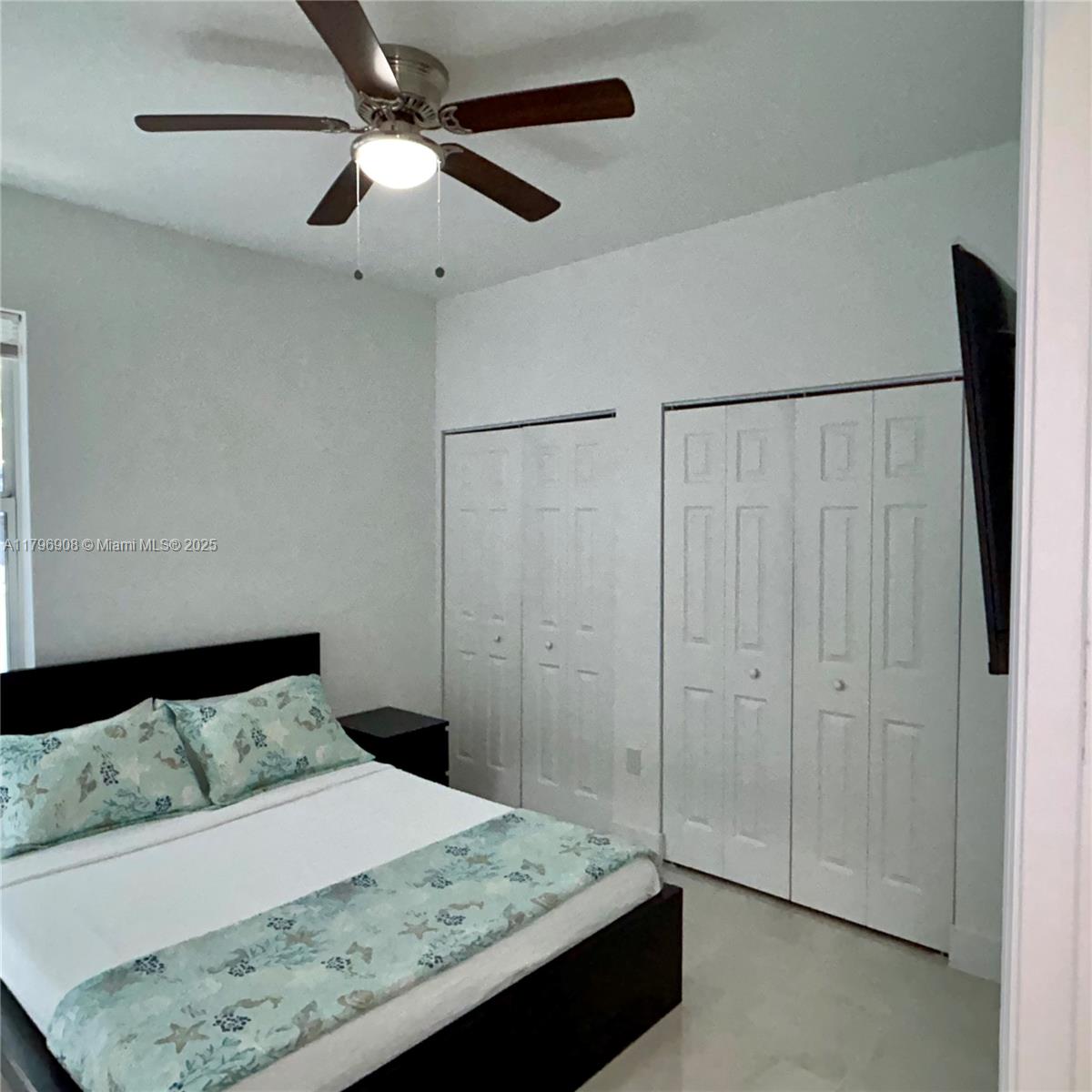 730 Largo Road Key Largo, FL 33037 - Photo 28 of 29 a bedroom with a bed and a dresser