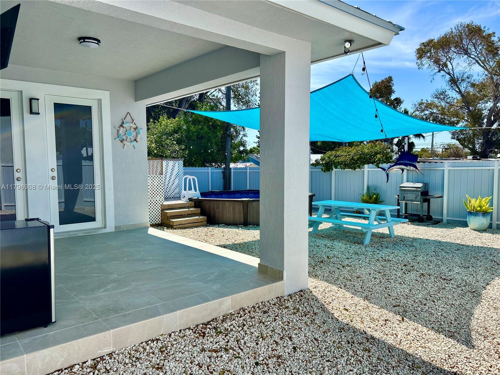 730 Largo Road Key Largo, FL 33037 - Photo 8 of 29 a view of a house with a backyard