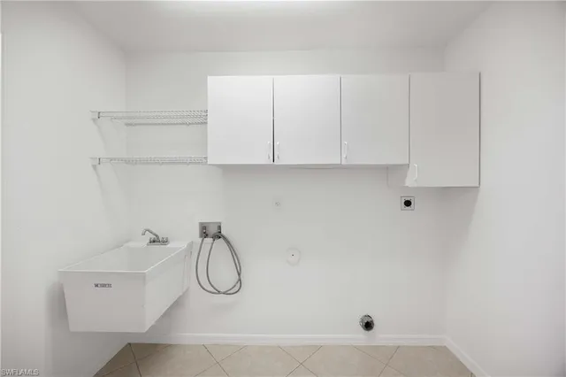 a bathroom with a granite countertop sink and a shower