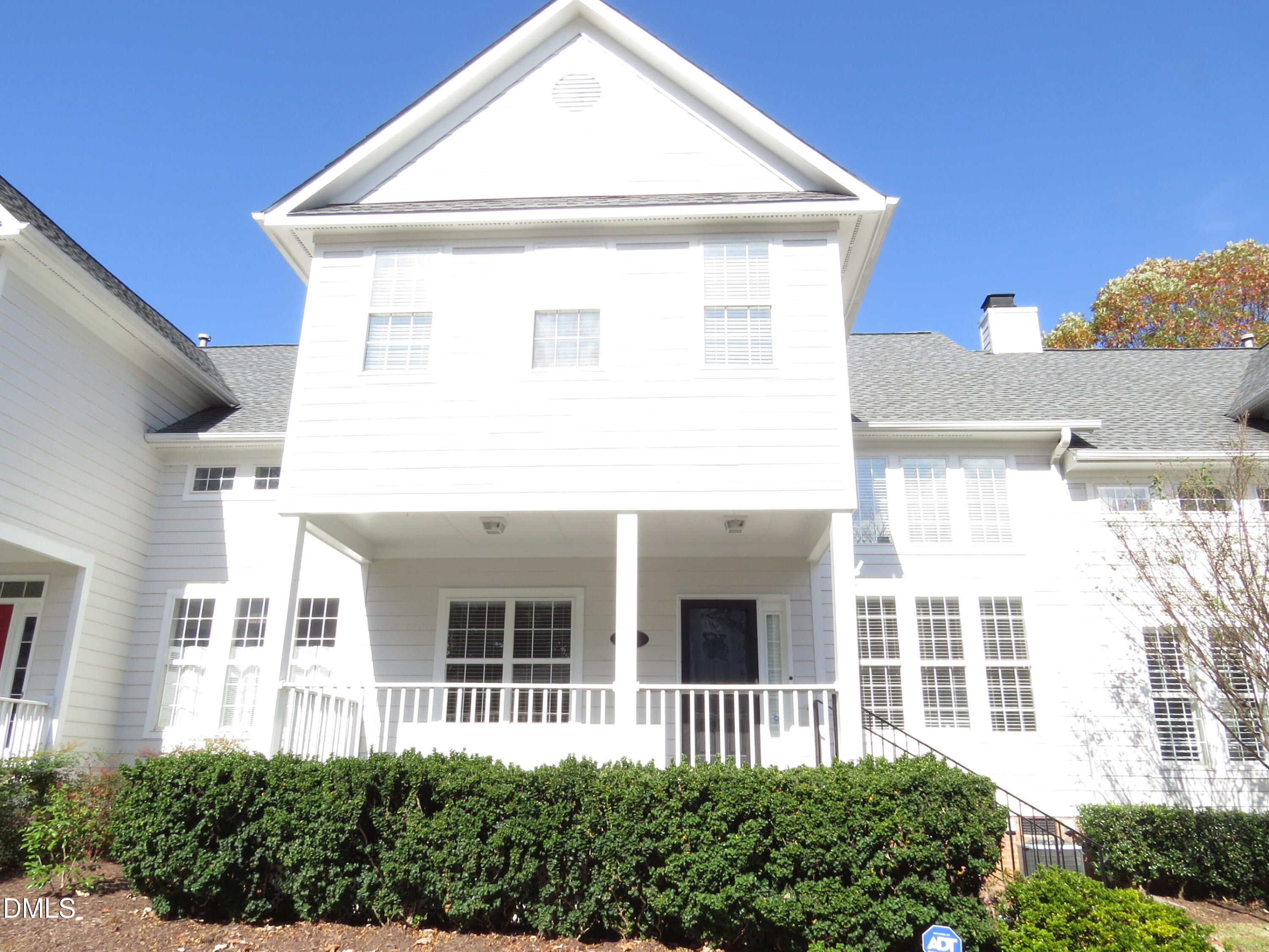 3912 Stags Leap Circle, Unit 27 Raleigh, NC 27612 - Photo 24 of 28 a view of a white house next to a yard