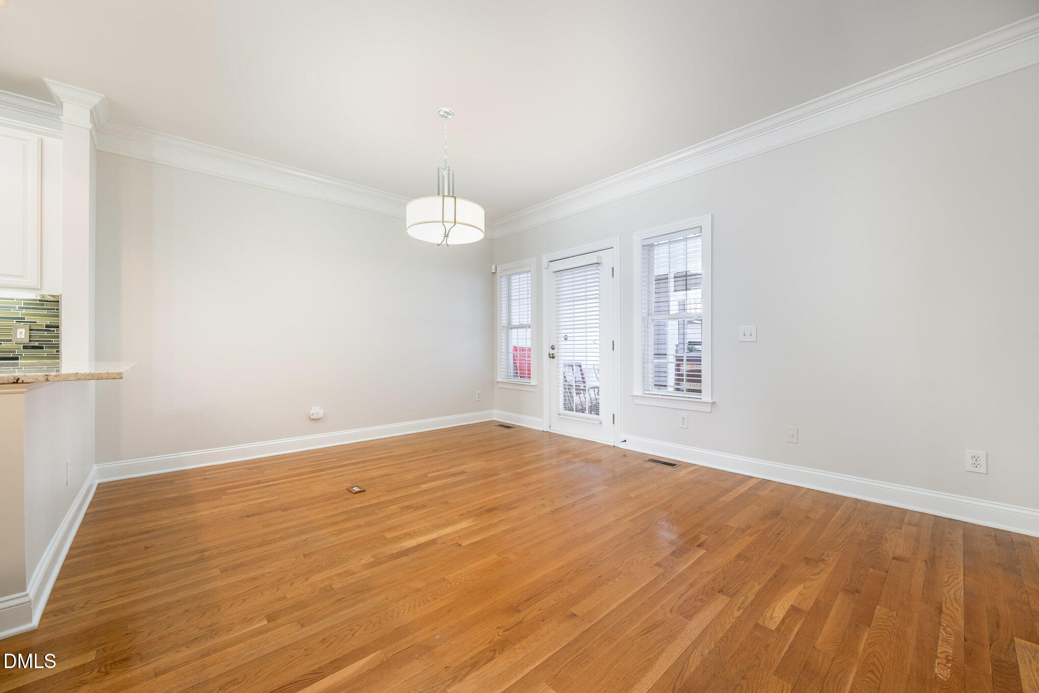 3912 Stags Leap Circle, Unit 27 Raleigh, NC 27612 - Photo 6 of 28 a view of empty room with wooden floor and fan