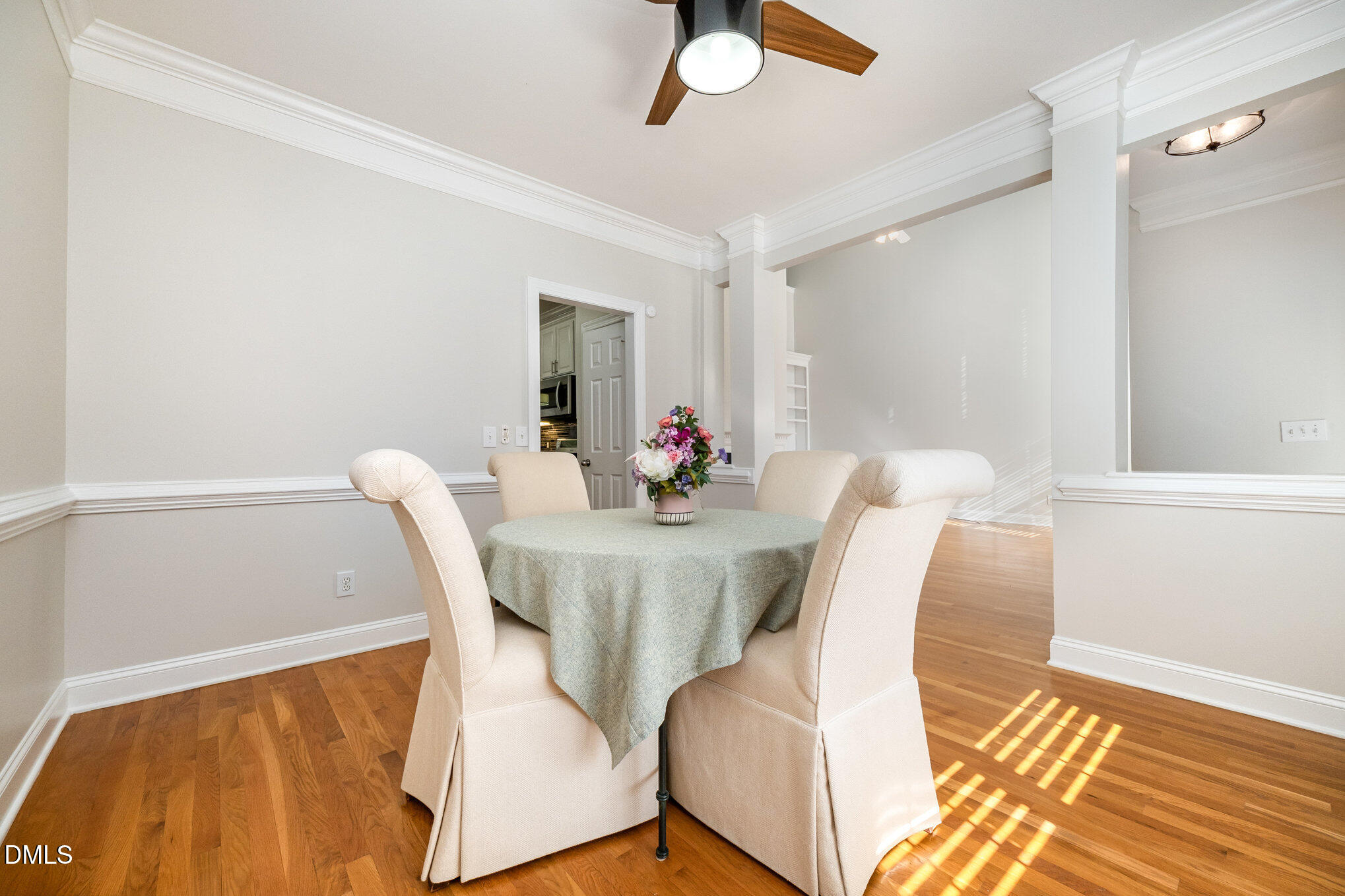 3912 Stags Leap Circle, Unit 27 Raleigh, NC 27612 - Photo 7 of 28 a view of a dining room with furniture and wooden floor