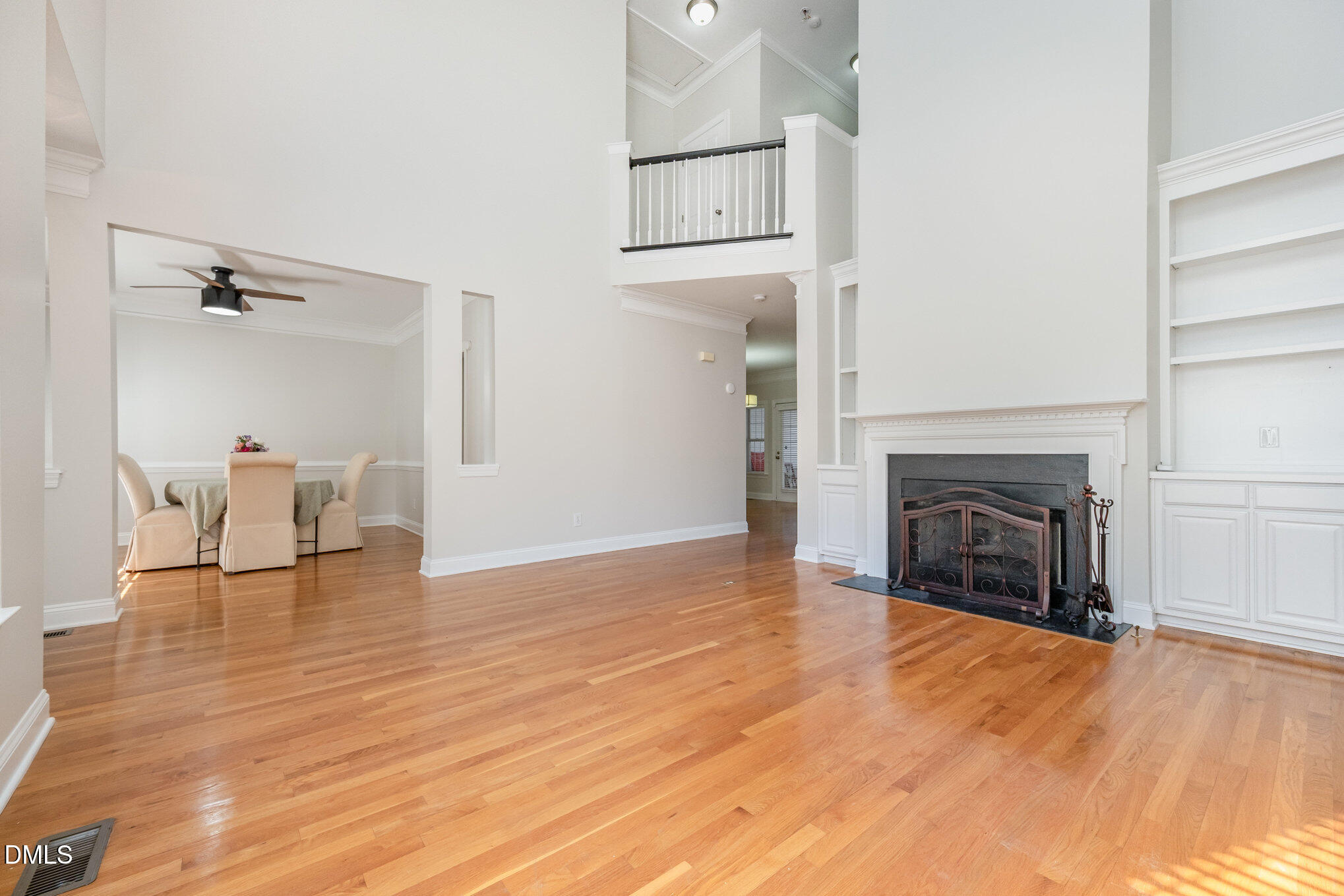 3912 Stags Leap Circle, Unit 27 Raleigh, NC 27612 - Photo 8 of 28 a view of empty room with wooden floor and fireplace
