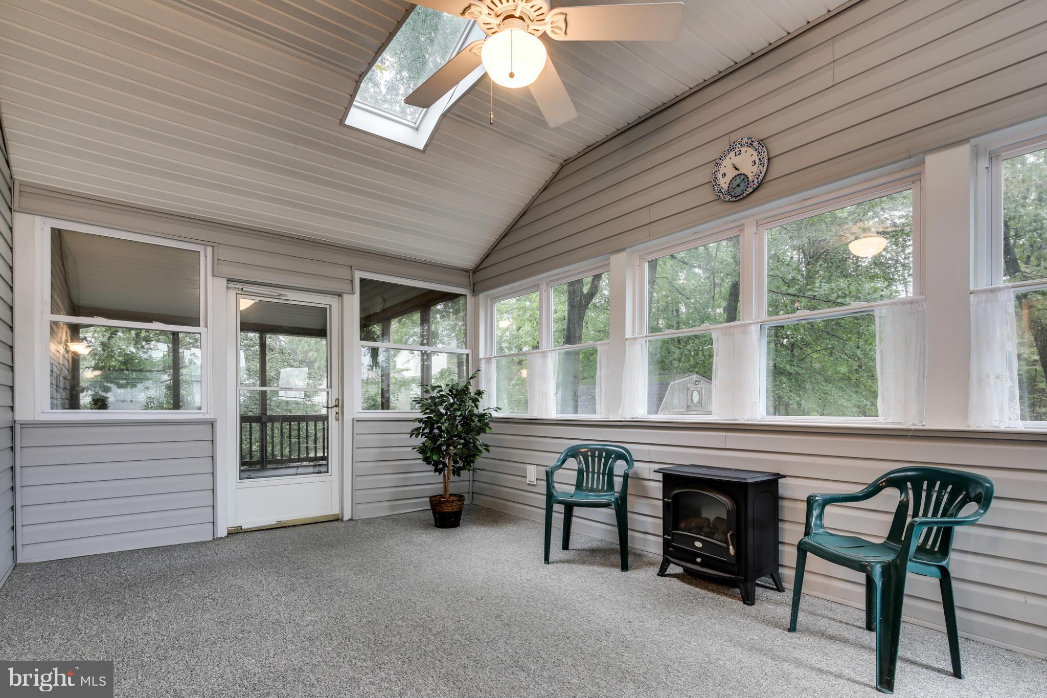 491 North Patuxent Road Odenton, MD 21113 - Photo 9 of 28 Large Sun Room connects to a breezy screen porch.