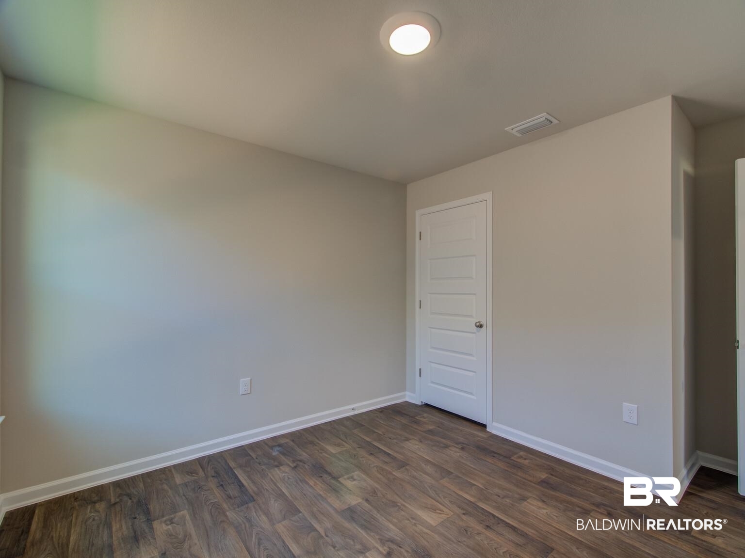 23953 Citation Loop Daphne, AL 36526 - Photo 23 of 49 Unfurnished room with baseboards and dark wood-style floors