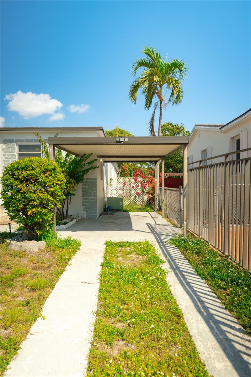 467 Southeast 3rd Street, Unit 1 Hialeah, FL 33010 - Photo 5 of 17 a view of a swimming pool with a patio